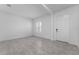 Bright living room with a door and window with tile flooring, crisp, white walls at 5376 Dagenham Dr, Davenport, FL 33837