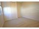 Bedroom features neutral carpet and spacious closet at 6065 Dory Way, Tavares, FL 32778