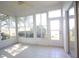 Sunroom filled with windows and a ceiling fan for comfort at 6065 Dory Way, Tavares, FL 32778