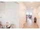 Bright hallway with wood-look tile flooring leading to the dining room and living room at 643 Taft Dr, Davenport, FL 33837