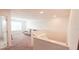 Loft with white walls and neutral carpet, featuring a cozy seating area at 643 Taft Dr, Davenport, FL 33837