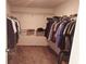 Spacious walk-in closet with lots of wire shelving for clothes and personal storage at 643 Taft Dr, Davenport, FL 33837