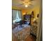 Bedroom featuring daybed, ceiling fan, accent rug, and writing desk at 719 Del Ray Dr, Kissimmee, FL 34758