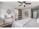 Bedroom featuring a modern sliding door leading to an ensuite bathroom at 7531 Lodge Pole Trl, Winter Park, FL 32792