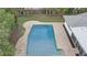 An aerial view of the in-ground swimming pool area with brick pavers at 7531 Lodge Pole Trl, Winter Park, FL 32792