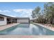 Inviting backyard pool featuring brick paver decking, and lush landscaping at 7531 Lodge Pole Trl, Winter Park, FL 32792