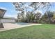 Backyard pool with brick pavers and lush green landscaping at 7531 Lodge Pole Trl, Winter Park, FL 32792