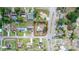 Aerial view of property showcasing it's location within a community, with mature trees and a long driveway at 759 Swallow St, Deltona, FL 32725