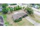 An aerial view of a single-story home with a long driveway and fenced yard at 759 Swallow St, Deltona, FL 32725