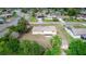 Aerial view of a house with a screened-in porch and a shed at 759 Swallow St, Deltona, FL 32725