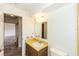 Bathroom featuring vanity with traditional hardware, and integrated sink with matching fixtures at 759 Swallow St, Deltona, FL 32725