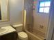 Bathroom with shower and tub, toilet and vanity with mirror at 759 Swallow St, Deltona, FL 32725