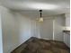 Dining area featuring a modern light fixture and tile flooring at 759 Swallow St, Deltona, FL 32725