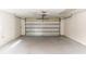 A spacious and clean garage, with freshly painted walls and floor, ready for use at 759 Swallow St, Deltona, FL 32725