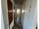 Hallway with tiled floor, and views of the bathroom at 759 Swallow St, Deltona, FL 32725