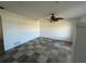 Spacious living room with ceramic tile flooring and ceiling fan at 759 Swallow St, Deltona, FL 32725