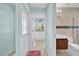 Hallway leading to a full bath and the laundry room at 7609 Sandstone Dr, Orlando, FL 32836