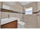 Modern bathroom featuring a glass-enclosed shower and stylish vanity at 7609 Sandstone Dr, Orlando, FL 32836