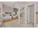 Spacious bathroom visible from the main bedroom, with a walk-in shower and a luxurious soaking tub at 7609 Sandstone Dr, Orlando, FL 32836