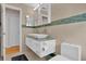 Modern bathroom featuring a double vanity with vessel sinks and a sleek, floating cabinet design at 7609 Sandstone Dr, Orlando, FL 32836