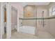 Spacious bathroom featuring a walk-in shower and a luxurious soaking tub at 7609 Sandstone Dr, Orlando, FL 32836