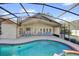 Beautiful screened-in pool and spa with direct access to the covered patio at 7609 Sandstone Dr, Orlando, FL 32836