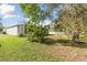 An expansive back yard featuring a screened-in porch offering a perfect spot for relaxation and entertaining at 939 Van Loon Ct, Kissimmee, FL 34758