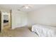 Neutral bedroom featuring a ceiling fan and a double door closet at 939 Van Loon Ct, Kissimmee, FL 34758