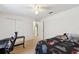 This bedroom features neutral walls, a ceiling fan, and a Star Wars comforter at 939 Van Loon Ct, Kissimmee, FL 34758