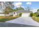 Beautiful single-story home featuring a well-manicured lawn and an attached two-car garage at 939 Van Loon Ct, Kissimmee, FL 34758