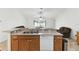 A partial kitchen view showcases an open layout with bar seating and access to the living area at 939 Van Loon Ct, Kissimmee, FL 34758