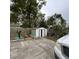 This is a backyard with a shed, landscaping, and a concrete area at 2600 Elm Ave, Sanford, FL 32773