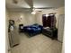 Bedroom featuring tile floors, neutral walls, and ceiling fan at 2600 Elm Ave, Sanford, FL 32773