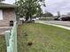 Exterior showing the lawn, landscaping, picket fence, and proximity to the sidewalk and street at 2600 Elm Ave, Sanford, FL 32773