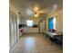 Neutral toned kitchen featuring tile floors, light cabinetry, natural light, and a ceiling fan at 2600 Elm Ave, Sanford, FL 32773