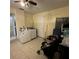 Laundry room featuring a washer/dryer, neutral walls, and tile floors at 2600 Elm Ave, Sanford, FL 32773