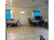 Spacious living room featuring tile floors, neutral walls, and natural light from the windows at 2600 Elm Ave, Sanford, FL 32773