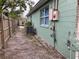 Exterior showing the side yard, fencing, utility connections, and the AC unit at 2600 Elm Ave, Sanford, FL 32773