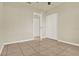 Bedroom featuring a tiled floor, a ceiling fan and built in closet at 10 Trophy Ln, Kissimmee, FL 34759