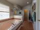 Bathroom featuring a large bathtub, tile flooring, and a window for natural light at 1045 S State Road 415, New Smyrna Beach, FL 32168