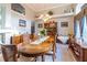 Formal dining room featuring hardwood furniture, unique decor, and lots of light at 1045 S State Road 415, New Smyrna Beach, FL 32168