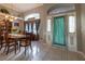 Bright foyer showcases tile flooring, natural light and a decorative front door at 1045 S State Road 415, New Smyrna Beach, FL 32168