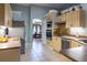 Eat-in kitchen features stainless steel appliances, tile floors, and easy access to the dining room at 1045 S State Road 415, New Smyrna Beach, FL 32168