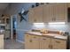 Well-maintained kitchen features wood cabinetry, tile flooring, and ample counter space at 1045 S State Road 415, New Smyrna Beach, FL 32168