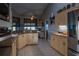 This well-designed kitchen offers a breakfast bar and a dining area with tons of natural light at 1045 S State Road 415, New Smyrna Beach, FL 32168