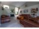 Comfortable living room with vaulted ceilings, wood flooring and fireplace at 1045 S State Road 415, New Smyrna Beach, FL 32168