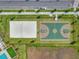 Aerial shot of recreational courts, featuring basketball and beach volleyball at 12136 Grammar Ln, Orlando, FL 32832