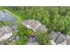 Aerial view of condo building with a pond nearby at 13013 Mulberry Park Dr # 222, Orlando, FL 32821