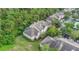 Aerial view of condo building next to lush woods at 13013 Mulberry Park Dr # 222, Orlando, FL 32821