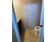 Small half-bathroom with tile floors, toilet, and granite countertop at 14218 Squirrel Run, Orlando, FL 32828